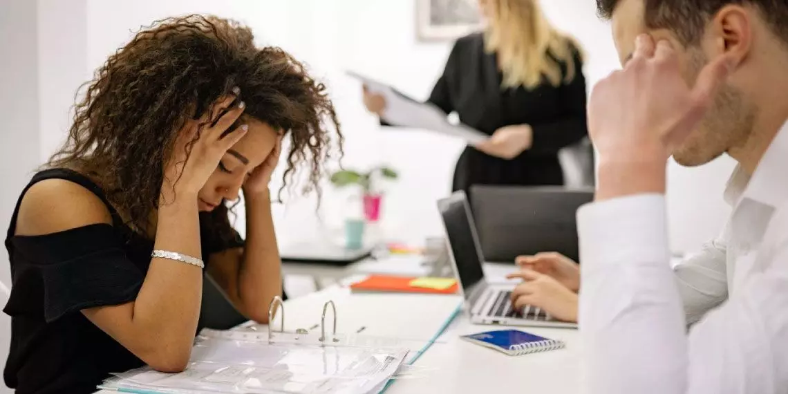 Woman feeling stressed at work