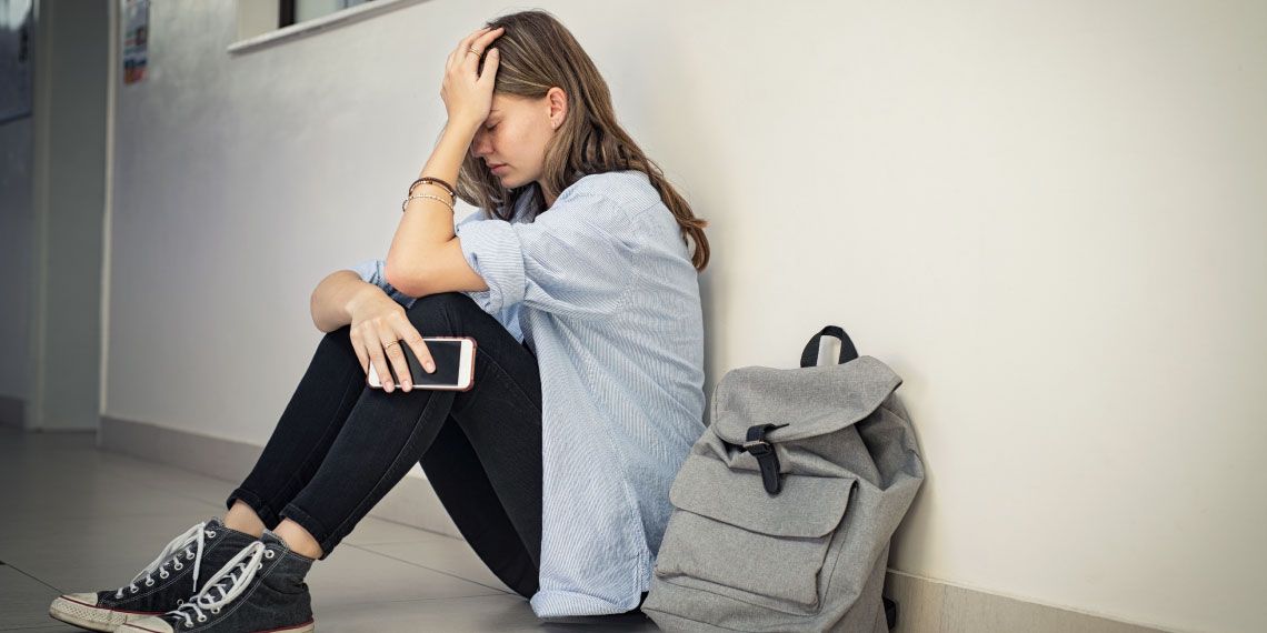 Image-1---Upset-teenage-girl-coping-with-emotional-distress-at-school..jpg