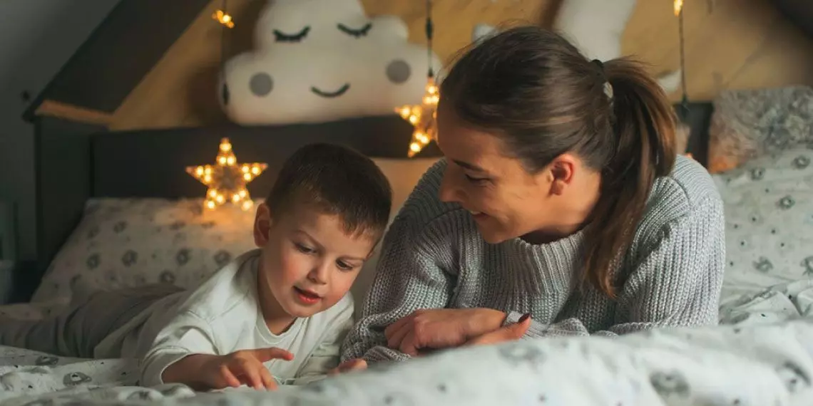 Mom and son sharing a bedtime moment for emotional comfort