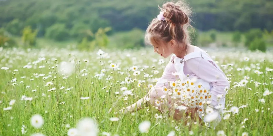 Child playing outside in spring
