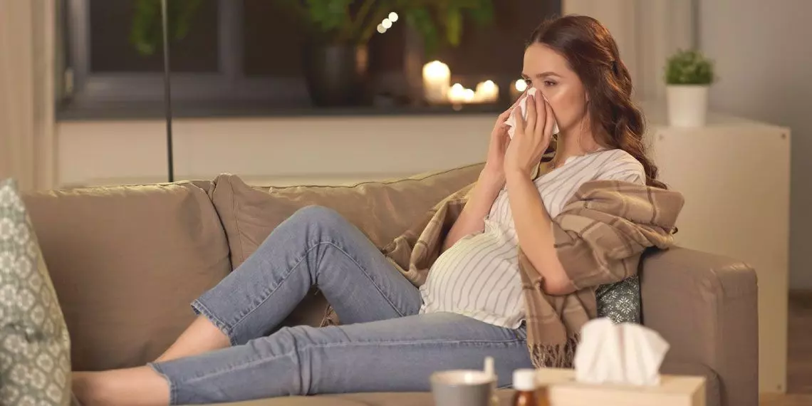 evening-cold-symptoms-pregnancy-on-sofa.jpg
