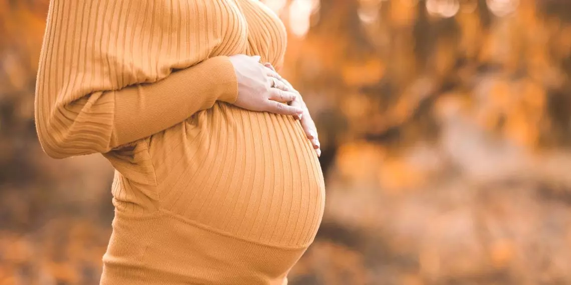 Image3-Pregnant-woman-holidng-hands-on-belly.jpg
