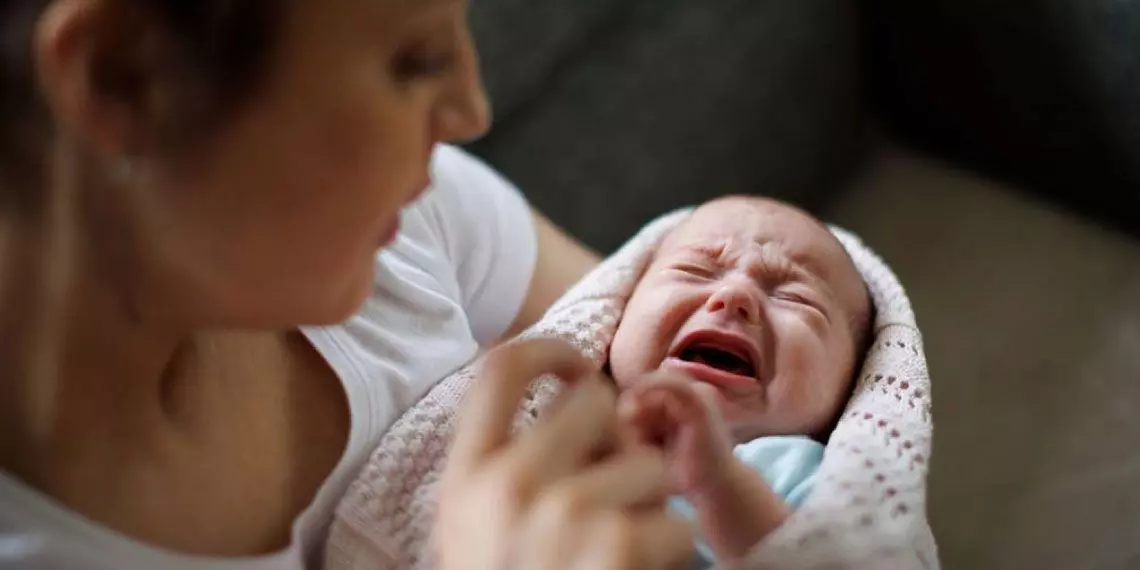 Mom-trying-to-console-uncomfortable-crying-baby.jpg