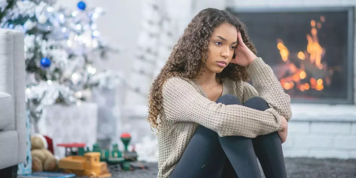 SAD-woman-by-Christmas-Tree.jpg